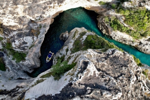 From Vlore: Grama Bay Caves & Beaches Speedboat Guided Tour