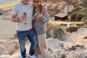 Kysttur ved solnedgang med champagne og middag