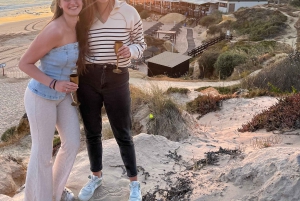 Kysttur ved solnedgang med champagne og middag