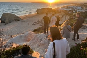 Kysttur ved solnedgang med champagne og middag