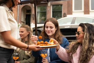 Amsterdão: cruzeiro aquecido e coberto pelos canais com bitterballen