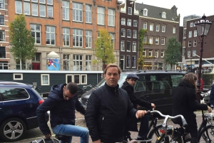 Amsterdam: Tour guiado de la ciudad en bicicleta en francés