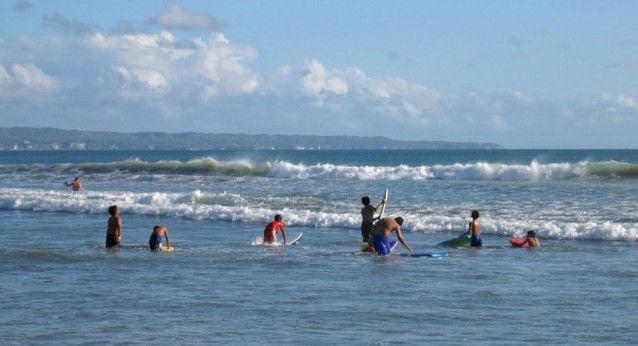 Youngsters trying smaller waves at Legian