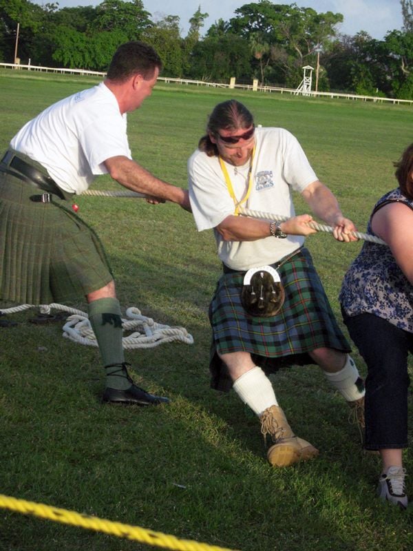 Piper Duncan and Jock from Killin Thyme band give a hand at the Tug o War at the Highland Games at The Garrison