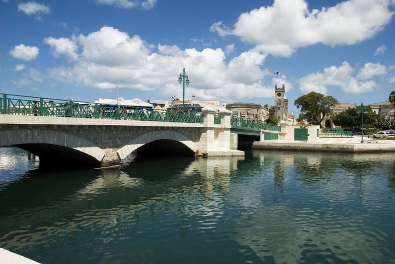 The Careenage in Bridgetown with the Swing Bridge in the foreground and the Parliament in the background