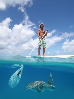 Brian 'DeActionMan' Talma paddle surfing