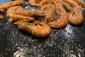 Aula de culinária noturna em Barcelona: 5 pratos, 3 paellas e cava