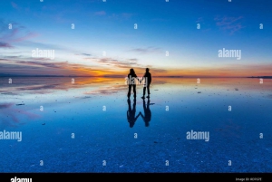 Seasonal tour: Sunrise with reflections in the water, Salar