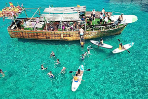 tour con esnórquel y surf de remo por cuevas marinas y calas