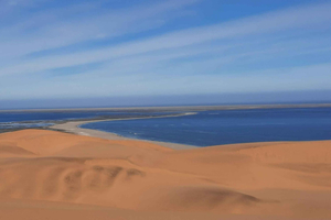 Small Group Sandwich Harbour 4x4 tour where dunes meet ocean