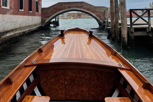 Hop on board an old Venetian boat