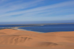 Small Group Sandwich Harbour 4x4 tour where dunes meet ocean