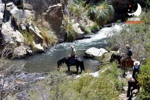 Horseback riding, river, and mountains in Pisco Elqui
