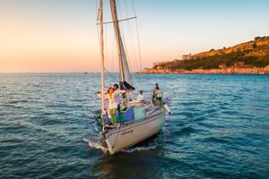 Lisbon: 'Sunset' & 'Day Tours' by boat, with drink and music