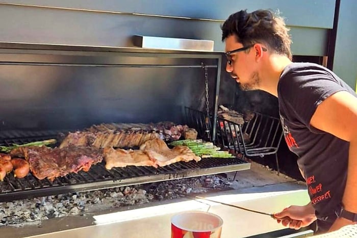 Enjoy a local asado in the Boedo neighborhood