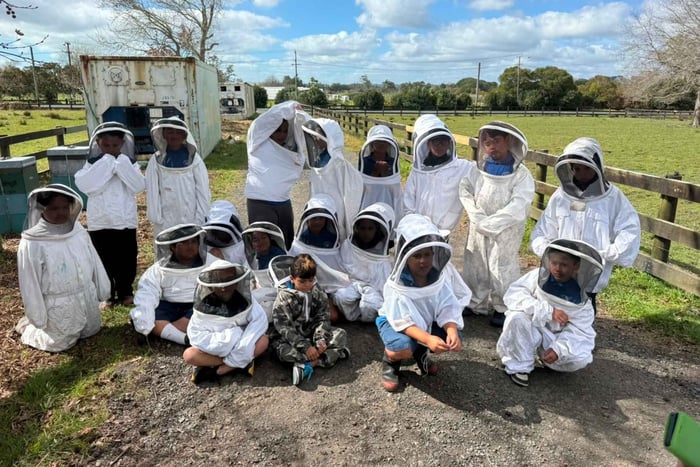 Hands-On Beekeeping Experience with Gear