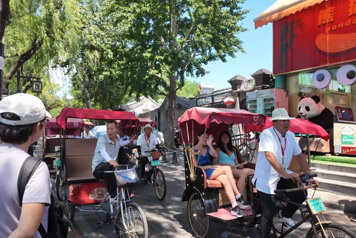 tour por los hutongs en carrito tirado y visita familiar