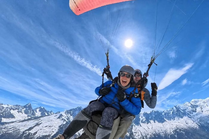 Paragliding flight facing Mont Blanc