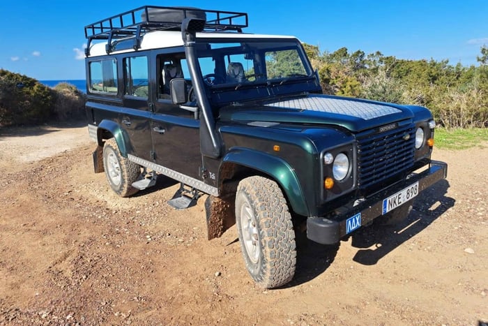 Troodos Mountains: a day trip with a green 4×4 Land Rover to villages and a monastery.