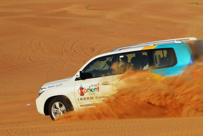 Dubai Desert Safari, Quad Biking, Camel Ride, & Sandboarding