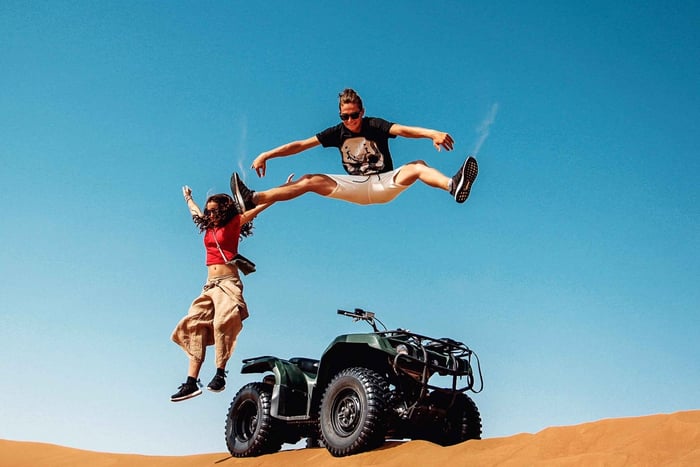 Dubai: Red Dunes Quad Bike with Sandboarding, Camels and BBQ