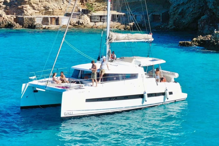 IBIZA: CATAMARAN, CUEVAS, CALA BASSA, AND CALA CONTE BEACH – STAND-UP PADDLEBOARDING, PADDLE TENNIS, AND SNORKELING