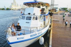 Cartagena: Sunset boat ride on the bay with an open bar and a musical show!