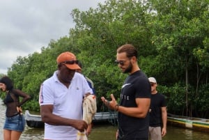 Typical lunch on beach, mangrove tour & fishing with natives