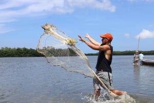 Typical lunch on beach, mangrove tour & fishing with natives