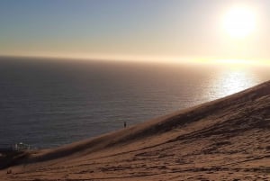 Sandboarding och solnedgång i Concons sanddyner