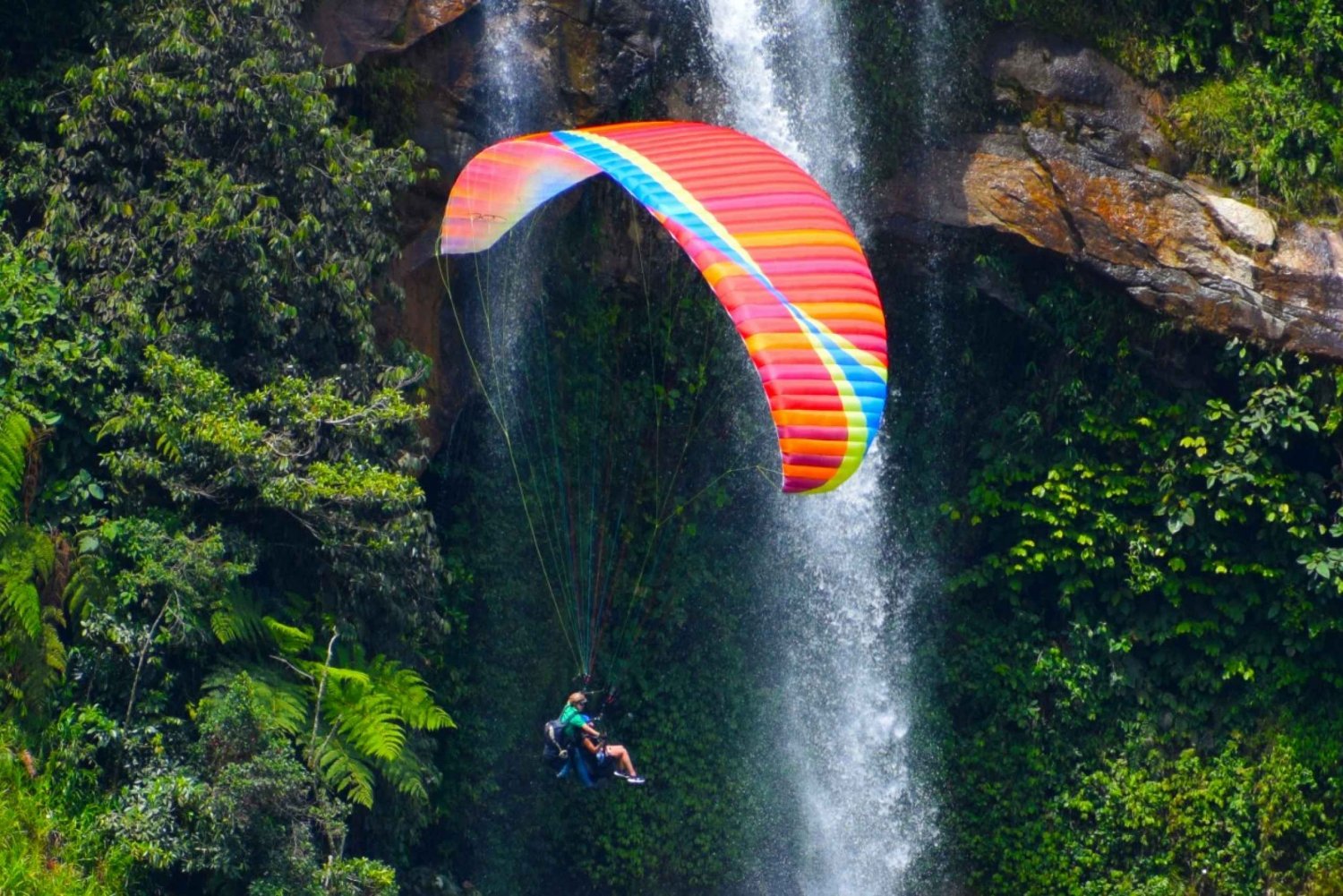 From Medellín: Paragliding and Rafting Combo Tour