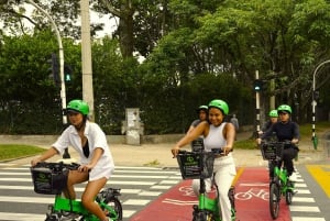 Medellín: Recorrido en bici por la ciudad con degustación de comida y bebida locales