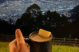 Night tour to 2 viewpoints in Medellín with a bonfire, music, and local flavor.