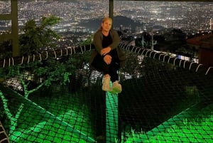 Night tour to 2 viewpoints in Medellín with a bonfire, music, and local flavor.