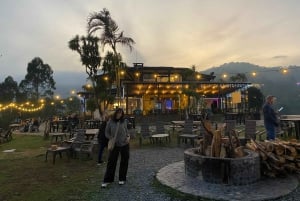 Night tour to 2 viewpoints in Medellín with a bonfire, music, and local flavor.