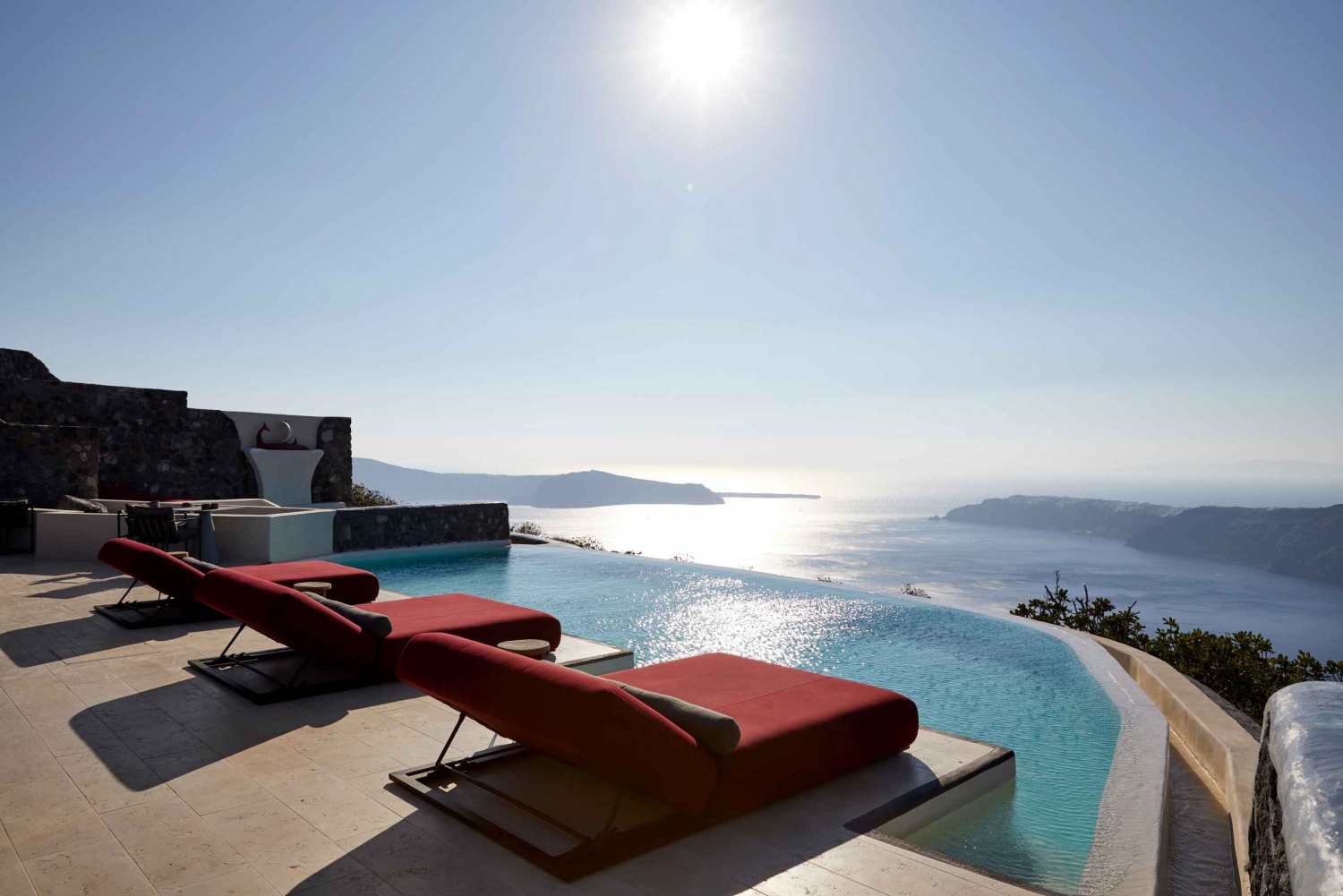 Daybed Relaxation with infinity pool use with caldera views