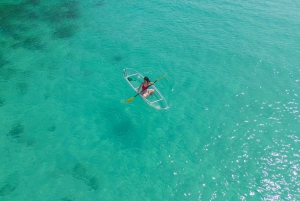 Excursión en kayak transparente al atardecer