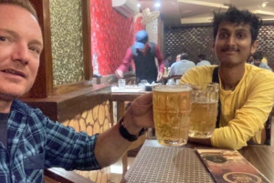 New Delhi: PrivÃ©belevenis met gids door het nachtleven met drankje