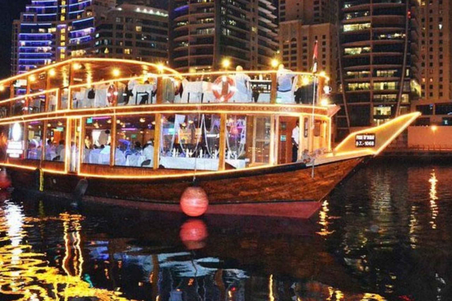 Dubai: Crucero con cena en dhow por la ría o el puerto deportivo con espectáculos en directo
