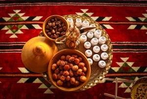 Dubaï : Les Dunes Rouges en Quad avec Sandboarding, Chameaux et BBQ