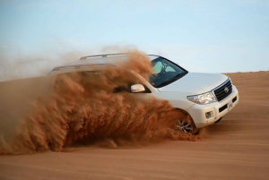 Dubai/Sharjah: Sunset Desert Safari with BBQ Dinner and Show