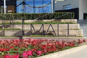 Privéchauffeur voor winkelen naar 'The Mall' en Prada Outlet