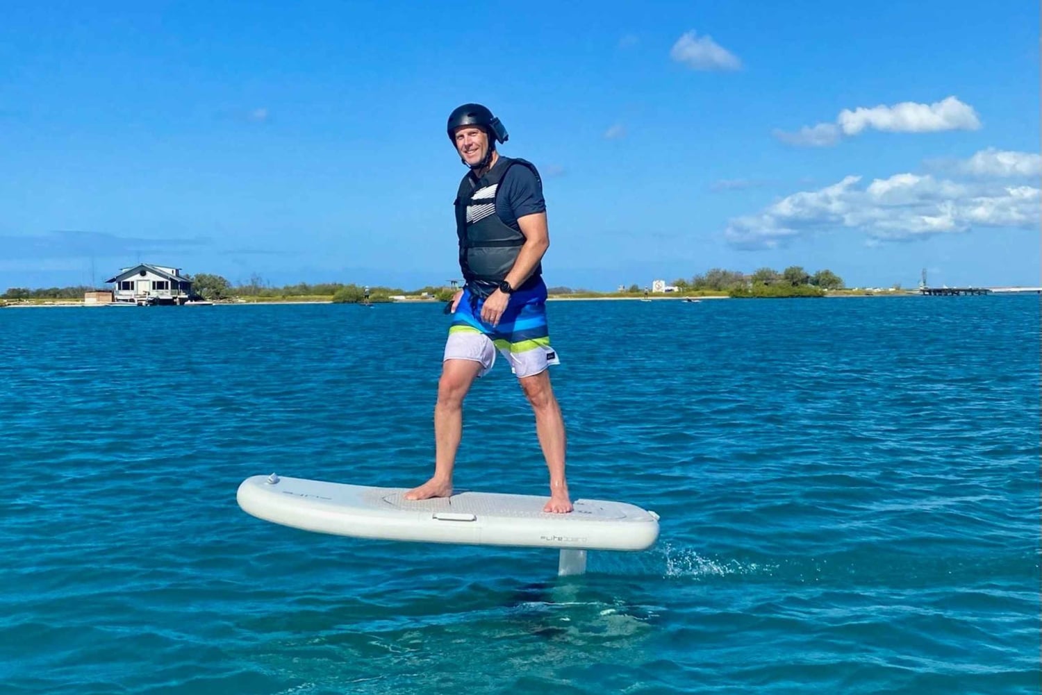 Hawaï: Elektrische draagvleugelboot groepsles surfen