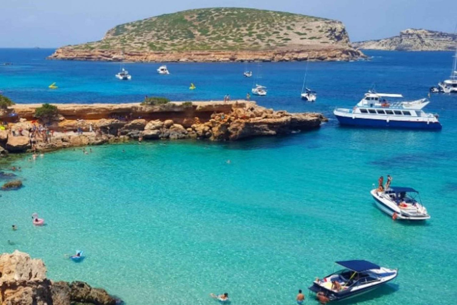 Ibiza: Boat tour, Snorkel, Paddle Surf, Tapas, and Open Bar.
