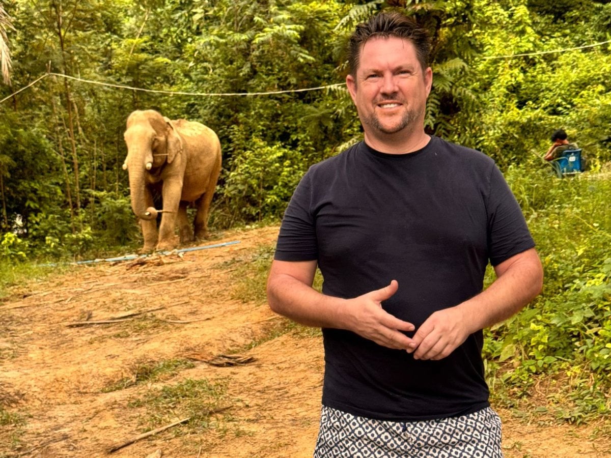 Mark at an elephant sanctuary in Thailand