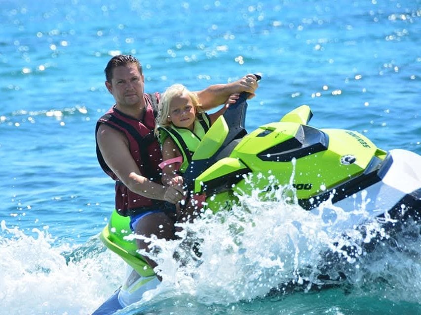 Mark and his daughter on a jet ski