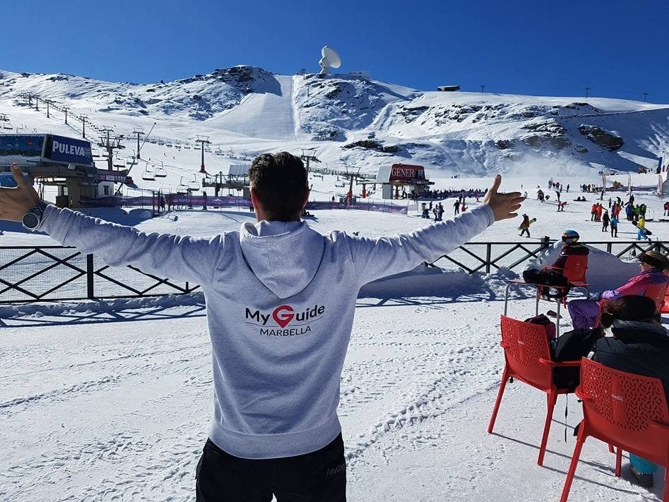 A My Guide Marbella hoodie on the ski slopes