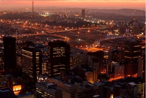 Johannesburg: geführte nächtliche Tour mit Abendessen und Getränken
