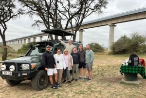 Nairobi National Park: with an open pop roof jeep