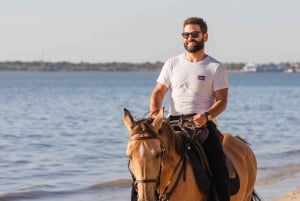 Horseback Riding on the Beach at Sunset